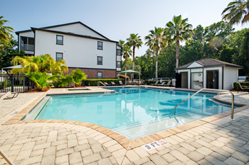 Resort-style swimming pool with sundeck & cabanas